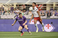 Fiorentina's Andrea Belotti, left, and Genoa's Koni De Winter go for the ball during the Serie A soccer match between Fiorentina and Genoa, at the Artemio Franchi Stadium in Florence, Italy, Monday April 15, 2024. (Massimo Paolone/LaPresse via AP)