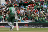 Bangladesh fans celebrate a four from Bangladesh's Shakib Al Hasan, foreground, during the Cricket World Cup match between South Africa and Bangladesh at the Oval in London, Sunday, June 2, 2019. (AP Photo/Matt Dunham)