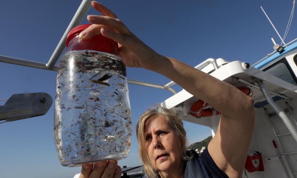 Maria-Luiza Pedrotti, a marine biologist who specialises in microplastics, looks at a sea sample taken from the Mediterraneean on a coastal research vessel near Villefranche-sur-Mer, France.