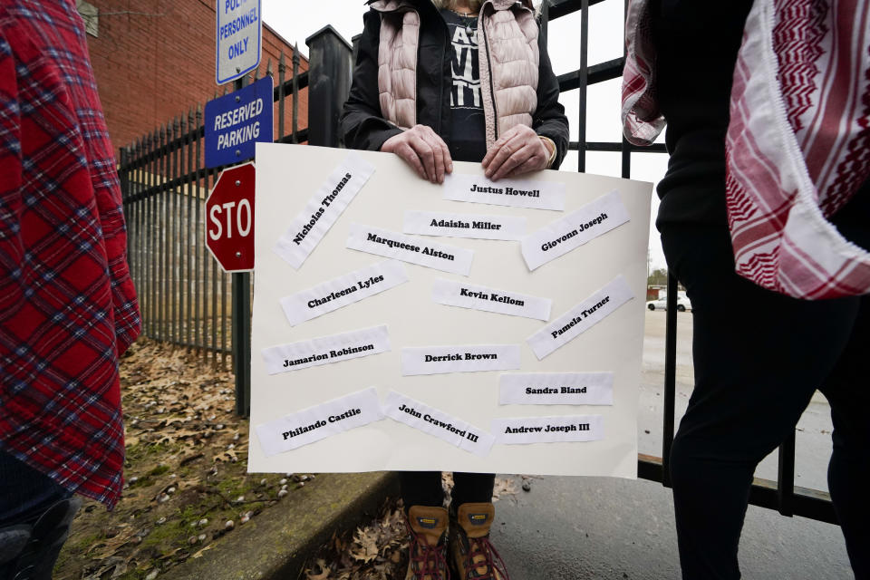 A group of demonstrators protest outside a police precinct in response to the death of Tyre Nichols, who died after being beaten by Memphis police officers, in Memphis, Tenn., Sunday, Jan. 29, 2023. (AP Photo/Gerald Herbert)