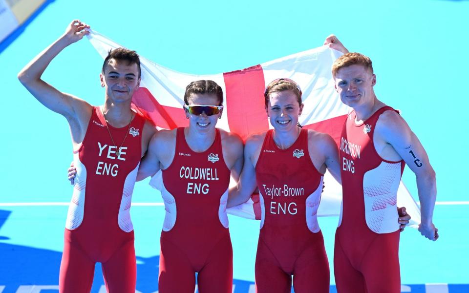 England team-mates Alex Yee, Sophie Coldwell Georgia Taylor-Brown and Samuel Dickinson celebrate winning the gold - SHUTTERSTOCK