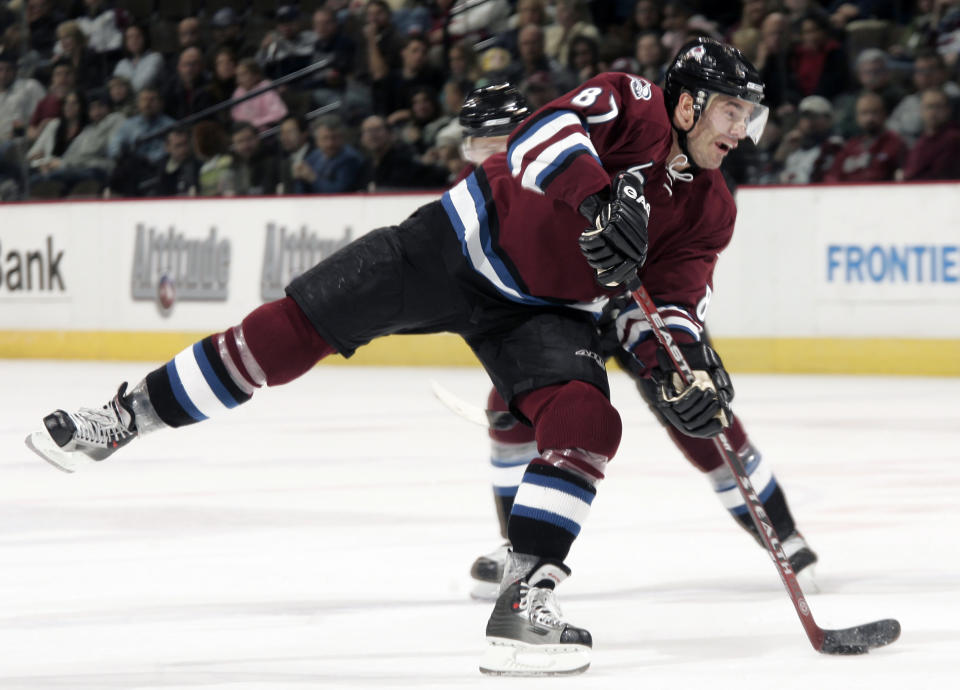 FILE - Colorado Avalanche center Pierre Turgeon takes a shot on goal against the St. Louis Blues during the third period of a hockey game in Denver, Wednesday, Dec. 13, 2006. Turgeon is one of five players elected to the Hockey Hall of Fame, Wednesday, June 21, 2023. (AP Photo/Jack Dempsey, File)