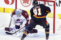 Colorado Avalanche goalie Justus Annunen makes a save against Calgary Flames' Nazem Kadri during the second period of an NHL hockey game Tuesday, March 12, 2024, in Calgary, Alberta. (Larry MacDougal/The Canadian Press via AP)