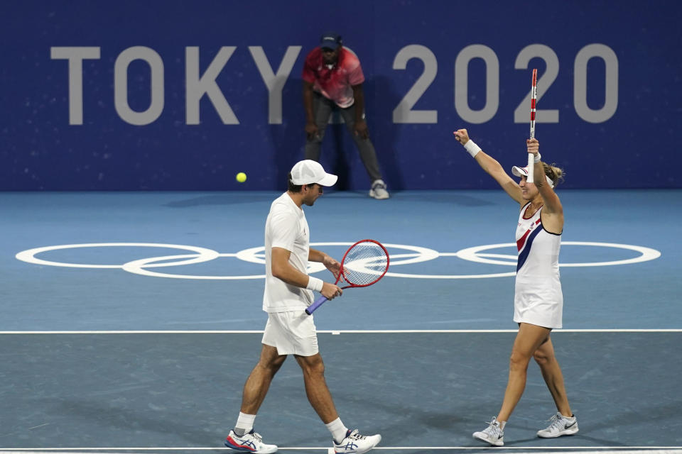 The Russian Olympic Committee mixed doubles team of Elena Vesina, right, and Aslan Karatsev celebrate after winning their semifinals match of the tennis competition at the 2020 Summer Olympics, Friday, July 30, 2021, in Tokyo, Japan. (AP Photo/Seth Wenig)