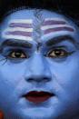 Feroz, 30, an Indian Muslim artist dressed like Hindu god Shiva performs during a cultural event in Allahabad, India, Wednesday, Dec. 22, 2010. (AP Photo/Rajesh Kumar Singh)