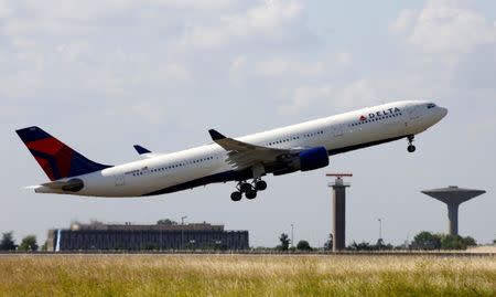 A Delta Air Lines Airbus A330 aircraft takes off at the Charles de Gaulle airport in Roissy, France, August 9, 2016. REUTERS/Jacky Naegelen