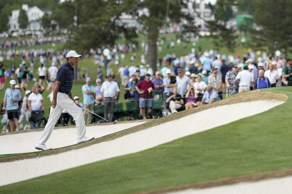 Tiger Woods walks up to the seventh green during the second round of the Masters golf tournament at Augusta National Golf Club on Friday, April 7, 2023, in Augusta, Ga. (AP Photo/David J. Phillip)