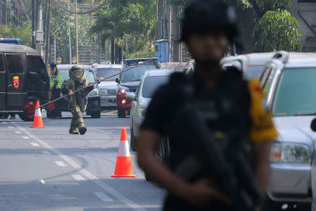 Police search the area at the Indonesian Christian Church following a blast in Surabaya, East Java, Indonesia May 13, 2018 in this photo taken by Antara Foto. Antara Foto/Didik Suhartono/ via REUTERS