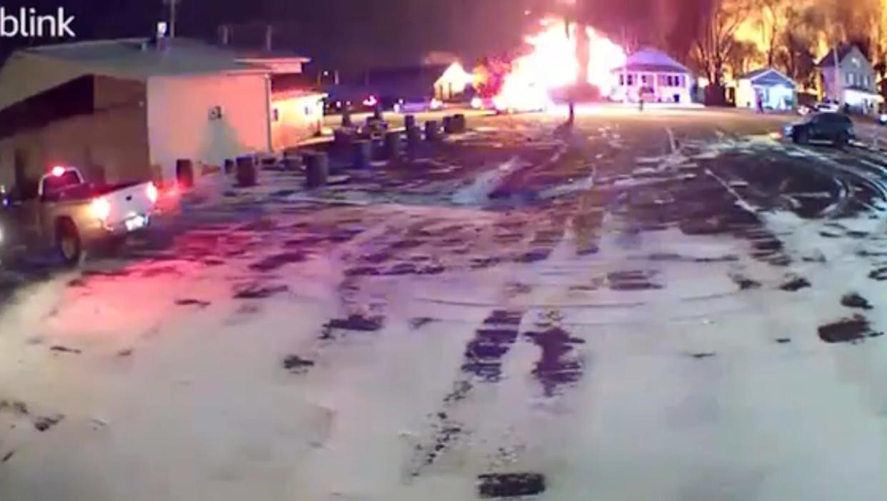 A view of the train derailment site from a few blocks away on East Taggart Street in East Palestine Ohio on the night of Feb. 3, 2023. An Amazon Blink security camera at McKim's Honeyvine and Winery on East Taggart Street captured footage of the derailed train as it went up in smoke.