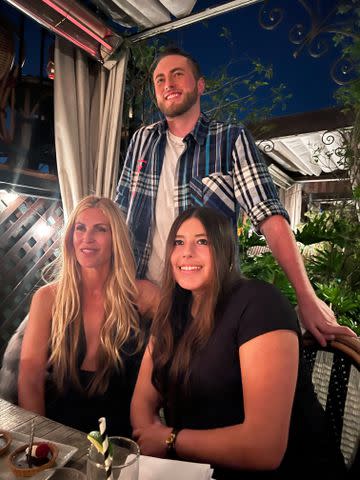 <p>pixie Productions</p> Mary Jo Eustace posing at a family dinner with her children, son Jack and daughter Lola.