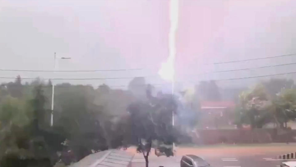 A still showing lightning striking a street light 11 times in China.