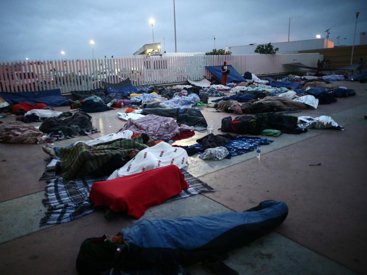 Central America migrants sleep near the San Ysidro checkpoint, in Tijuana, Mexico: REUTERS/Edgard Garrido