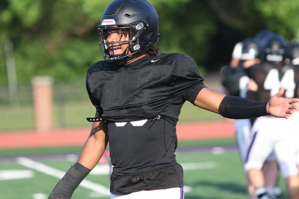 Lipscomb Academy four-star defensive back CJ Jimcoily talks to coaches on the sideline during the Lipscomb Academy Football Showcase on Thursday, May 9, 2024, at Lipscomb Academy in Nashville, Tennessee.