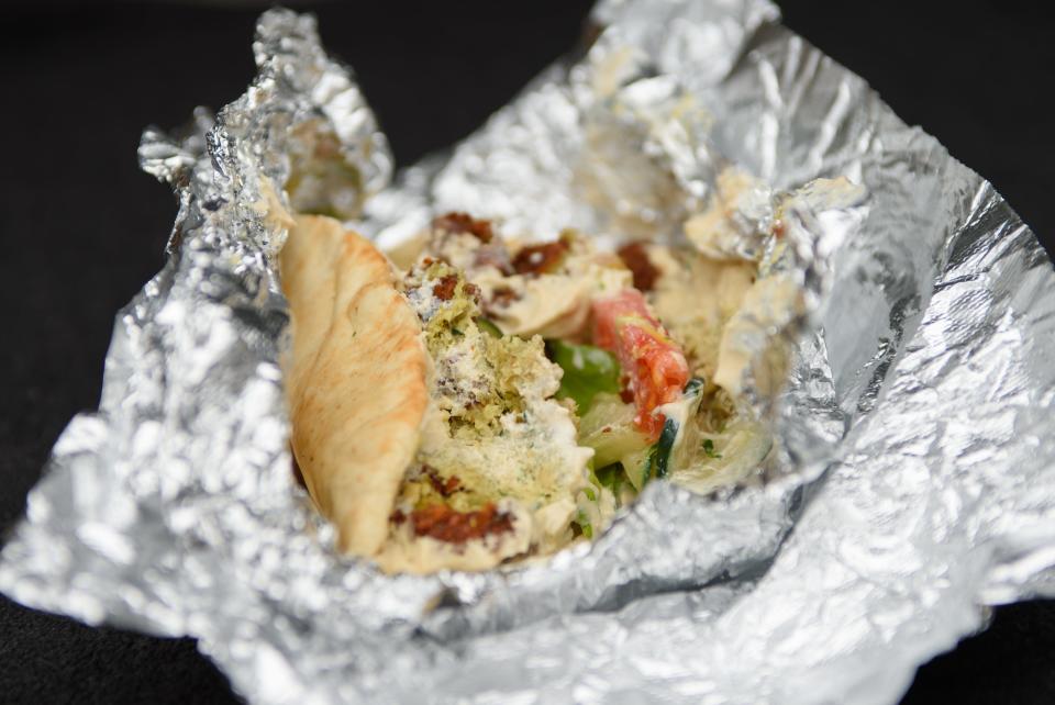 A traditional falafel wrap from Petra Café in Hattiesburg costs $7.83.