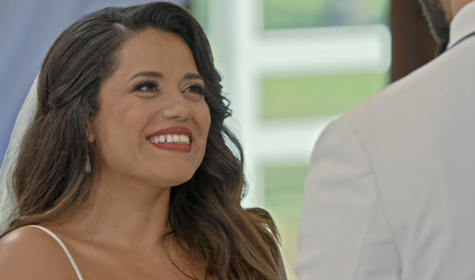 Nancy smiles at Bartise during their wedding ceremony
