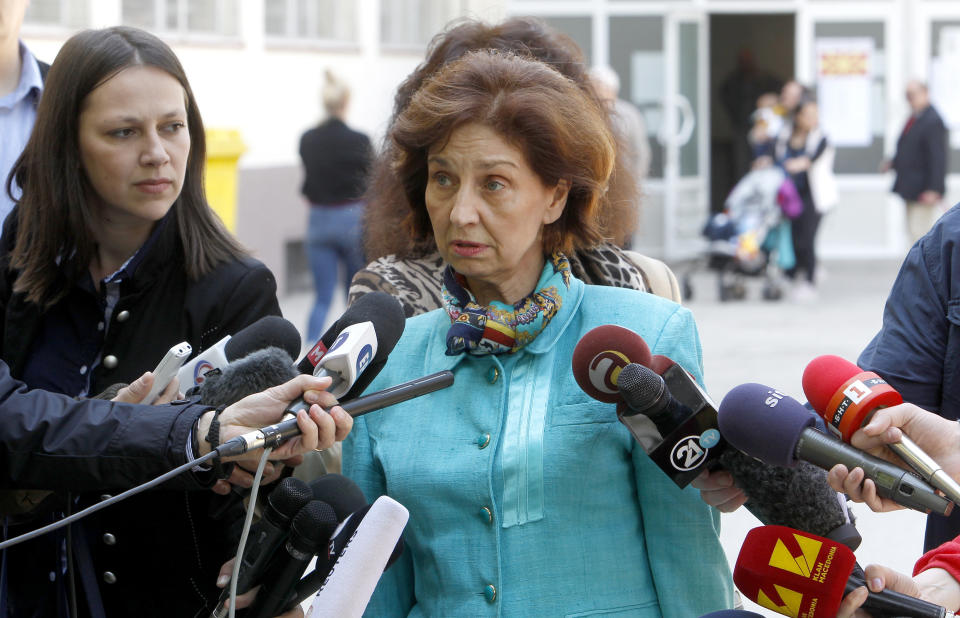 Gordana Siljanovska Davkova, a presidential candidate for the opposition conservative VMRO-DPMNE party, talks to the media outside a polling station, after voting in the presidential elections, in Skopje, North Macedonia, Sunday, April 21, 2019. North Macedonia holds the first round of presidential elections on Sunday, seen as key test of the government following deep polarization after the country changed its name to end a decades-old dispute with neighboring Greece over the use of the term "Macedonia". (AP Photo/Boris Grdanoski)