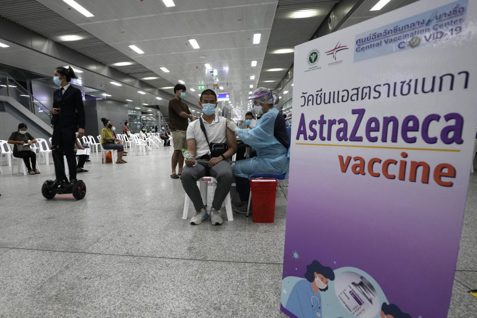 A health worker administer doses of the AstraZeneca COVID-19 vaccine at the Central Vaccination Center in Bangkok, Thailand, Wednesday, July 14, 2021. Health authorities in Thailand said Wednesday they will seek to put limits on the export of locally produced AstraZeneca vaccine, as the country’s supplies of COVID-19 vaccines are falling short of what is needed for its own population. (AP Photo/Sakchai Lalit)