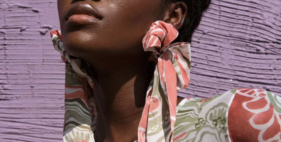 black owned jewelry brands, woman wearing andrea iyamah euca bow earring