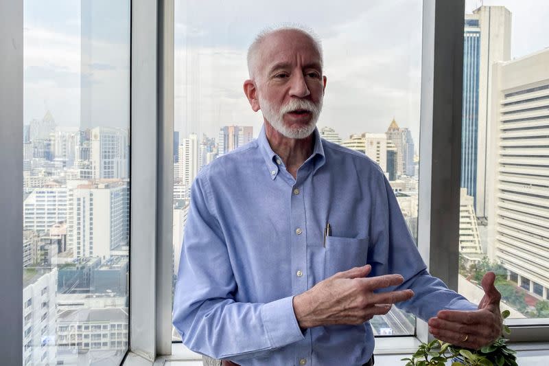 Peter Fischbach, a U.S. citizen member of Democrats Abroad, poses during an interview with Reuters in Bangkok