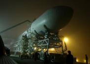 SpaceX's first upgraded Falcon 9 rocket, a Falcon 9 v1.1, rolls out to its launch pad at Vandenberg Air Force Base in California for a September 2013 launch debut.