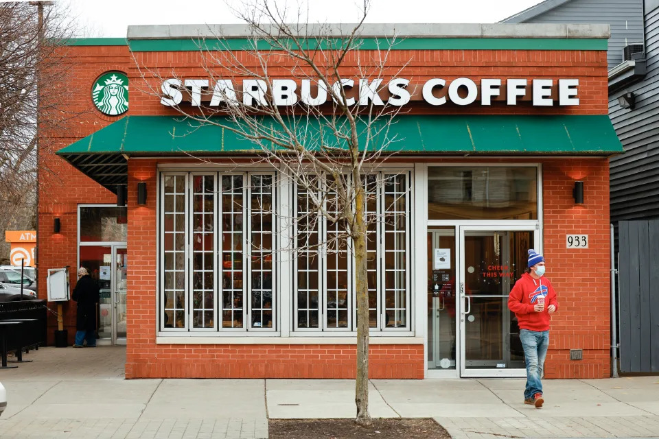 A customer exits a Starbucks in Buffalo, New York, U.S., December 7, 2021.  REUTERS/Lindsay DeDario