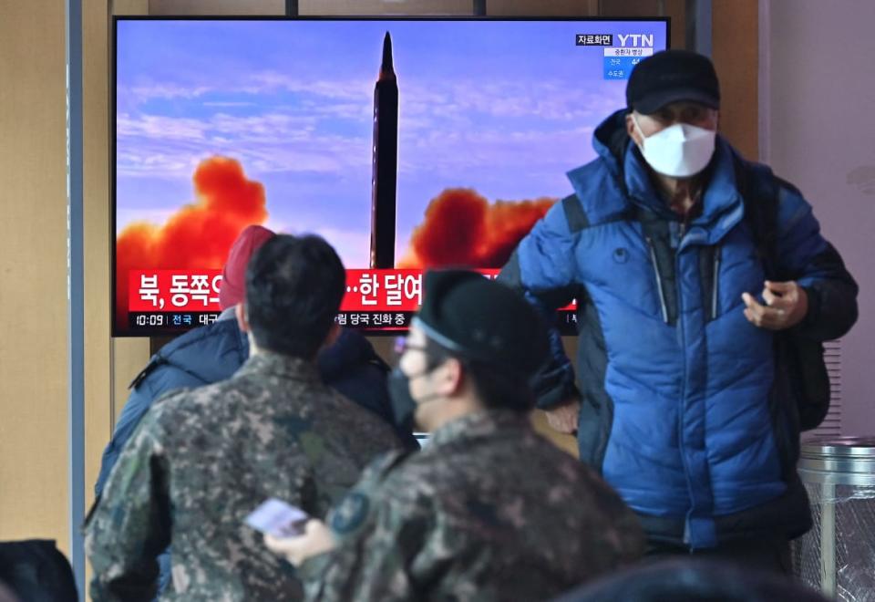 <div class="inline-image__caption"><p>People watch a television screen showing a news broadcast with file footage of a North Korean missile test, at a railway station in Seoul on Feb. 27, 2022, after North Korea fired an “unidentified projectile,” according to the South’s military.</p></div> <div class="inline-image__credit">Jung Yeon-je/AFP via Getty</div>