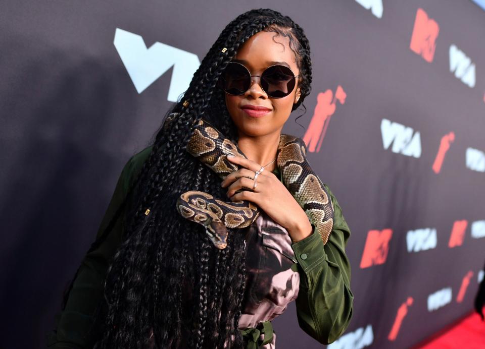 H.E.R. will perform alongside the British superstar (Charles Sykes/Invision/AP)