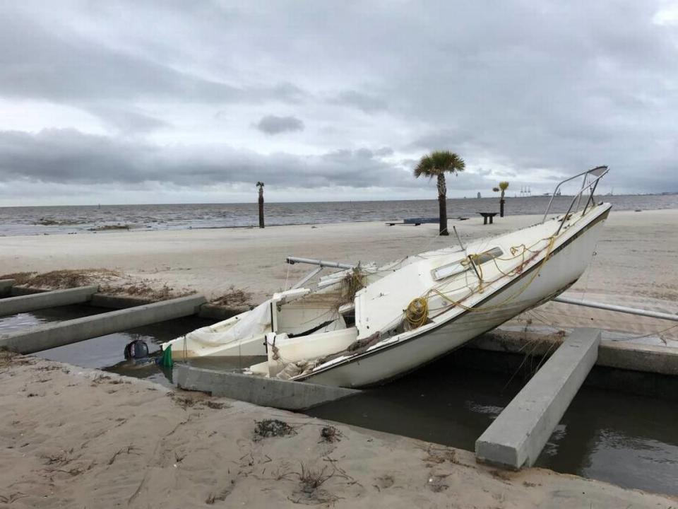 This boat washed ashore in Gulfport near the Courthouse Road pier. Crews were assessing damages from Hurricane Nate on Sunday in South Mississippi. John Fitzhugh/jcfitzhugh@sunherald.com