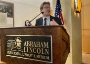 Christian McWhirter, Lincoln historian at the Abraham Lincoln Presidential Library and Museum addresses the importance of the desk that Abraham Lincoln used to draft the presidential inaugural address Thursday, Sept. 16, 2021 in Springfield, Ill.. The desk that Abraham Lincoln used to draft the presidential inaugural address he delivered on March 4, 1861, on the eve of the Civil War, is on display free to the public. Lincoln needed a quiet place away from well-wishers to write the speech, and his brother-in-law, Clark Moulton Smith, offered him a third-floor storage room in the store he owned on the state Capitol square in downtown Springfield. The state purchased the desk from the Smith family in 1953 and this summer spent $6,300 to have it historically restored and repaired. (AP Photo/John O'Connor)