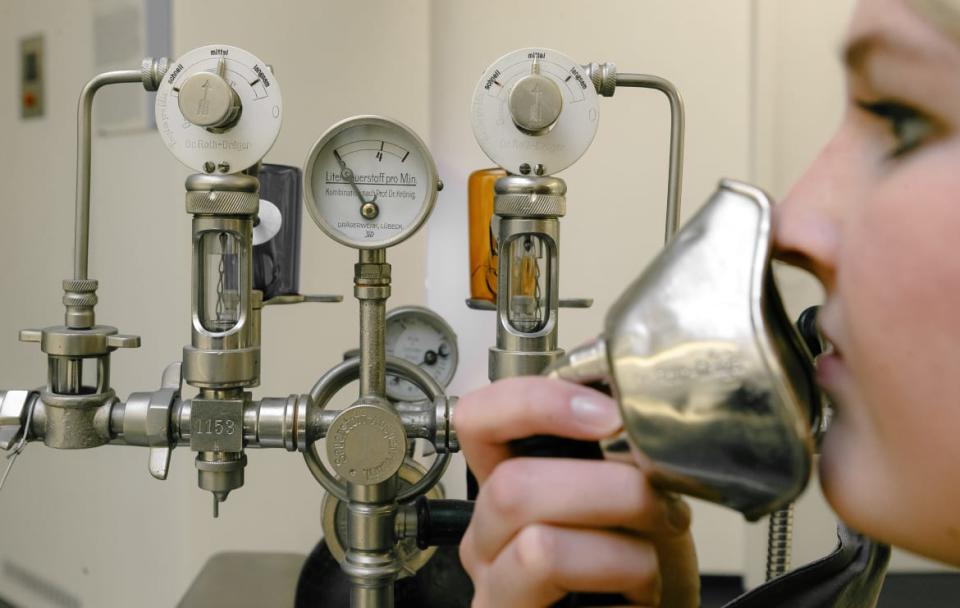 <div class="inline-image__caption"><p>"A young woman demonstrates an anesthesia machine from 1910 with the first mix of oxygen, chloroform and ether at the factory museum in Luebeck, Germany. </p></div> <div class="inline-image__credit">Markus Scholz/picture alliance via Getty</div>