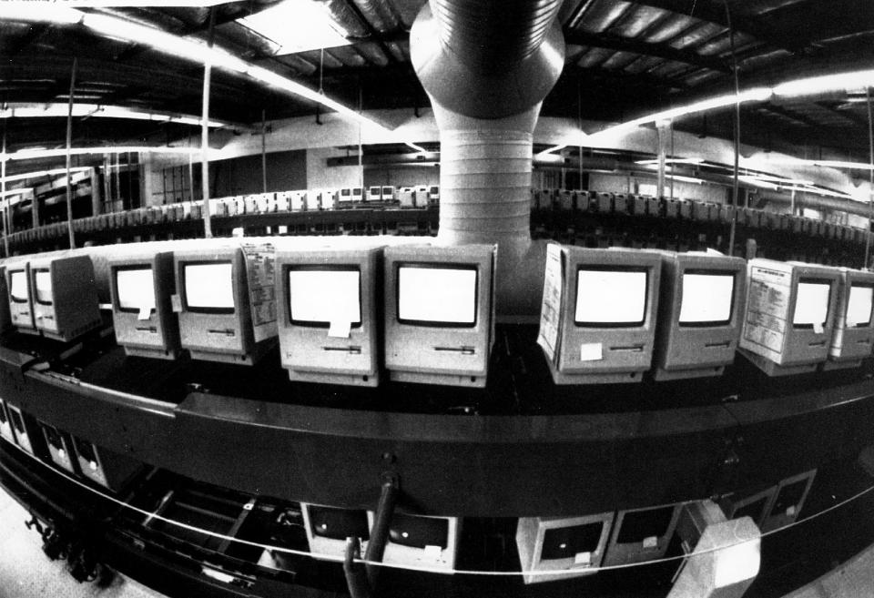 FILE - In this March 28, 1984, file photo, thousands of Apple Macintosh computers sit on double decked manufacturing lines. Friday, January 24, 2014, marks thirty years after the first Mac computer was introduced, sparking a revolution in computing and in publishing as people began creating fancy newsletters, brochures and other publications from their desktops. (AP Photo/Paul Sakuma, File)