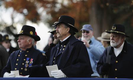 U.S. Civil War re-enactor Union officers listen to speeches at the Gettysburg National Cemetery in Pennsylvania November 19, 2013, the burial ground for Civil War Union soldiers in which U.S. President Abraham Lincoln travelled to in 1863 to deliver a few concluding remarks at a formal dedication. REUTERS/Gary Cameron