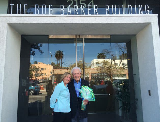 <p>PETA</p> Bob Barker poses for a photo in front of PETA's "The Bob Barker Building."