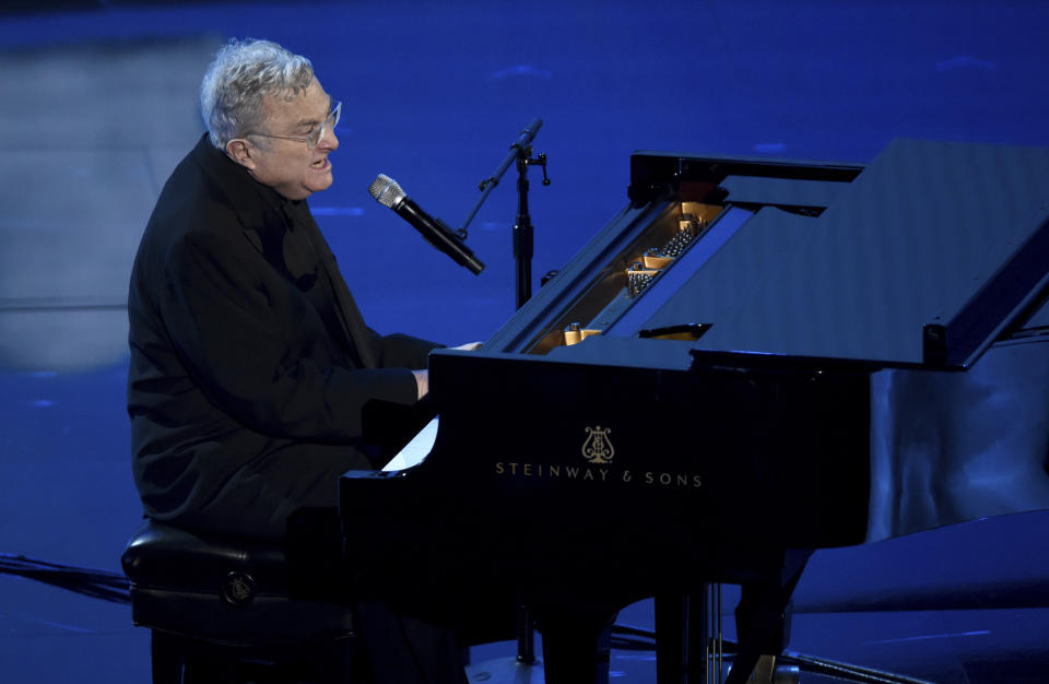 Randy Newman performs "I Can't Let You Throw Yourself Away," nominated for best original song from "Toy Story 4," at the Oscars on Sunday, Feb. 9, 2020, at the Dolby Theatre in Los Angeles. (AP Photo/Chris Pizzello)