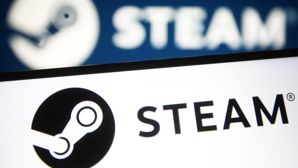   illustration a Steam logo of a video game digital distribution service is seen on a smartphone and a pc screen. 