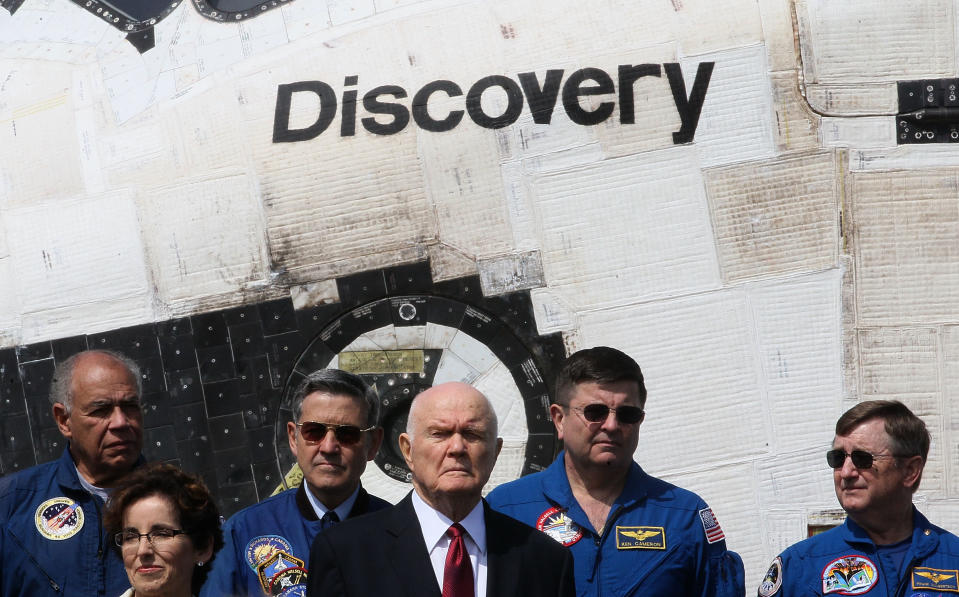 Former Astronaut and former U.S. Senator John Glenn (D-OH) stands in front of the Space Shuttle Discovery during an event at the Smithsonian National Air and Space Museum Steven F. Udvar-Hazy Center April 19, 2012 in Chantilly, Virginia. The space shuttle Discovery is the he oldest and most traveled vehicle from NASA's space shuttle program, and will replace the Interprise at the museum. (Photo by Mark Wilson/Getty Images)