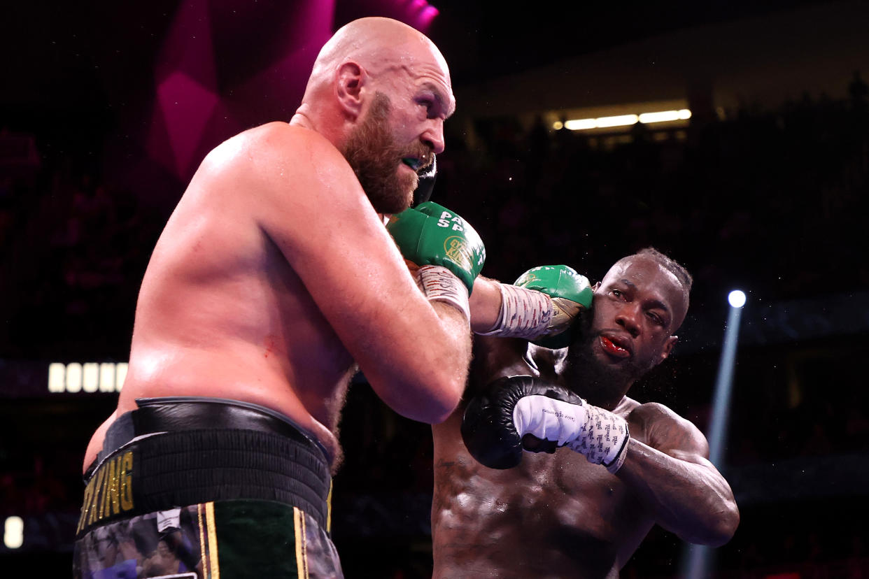 LAS VEGAS, NEVADA - OCTOBER 09: Tyson Fury (L) punches Deontay Wilder during their WBC heavyweight title fight at T-Mobile Arena on October 09, 2021 in Las Vegas, Nevada. (Photo by Al Bello/Getty Images)