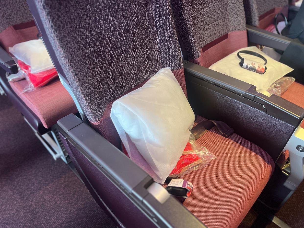 The headphones and linens in Virgin's A330neo economy cabin.