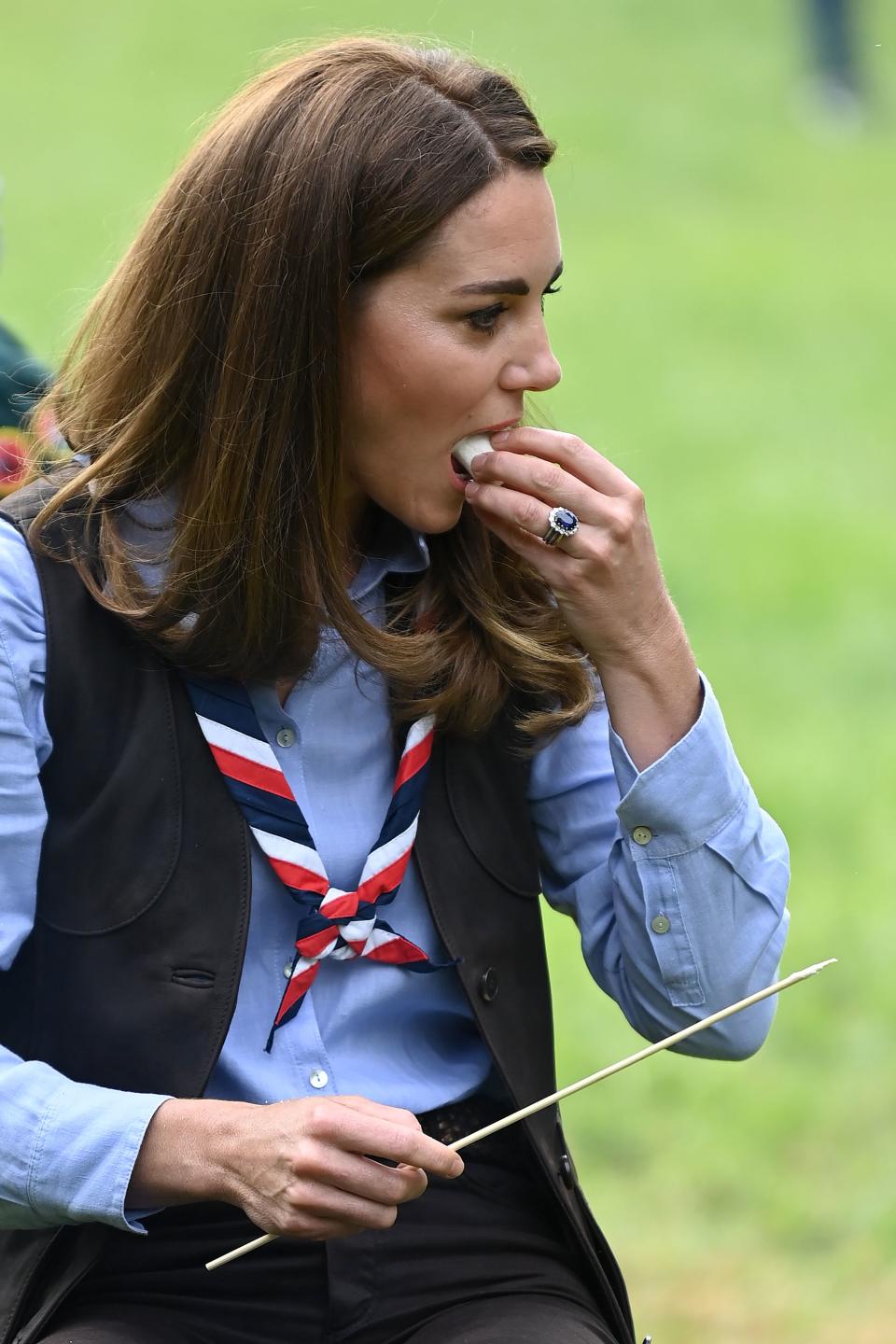 Britain's Catherine, Duchess of Cambridge, toasts marshmallows during her visit to a Scout Group in Northolt, northwest London on September 29, 2020, where she joined Cub and Beaver Scouts in outdoor activities. - The Duchess learned how the Scouts have adapted during the COVID-19 pandemic, and continued Scouting sessions and online activities. (Photo by DANIEL LEAL-OLIVAS / various sources / AFP) (Photo by DANIEL LEAL-OLIVAS/AFP via Getty Images)