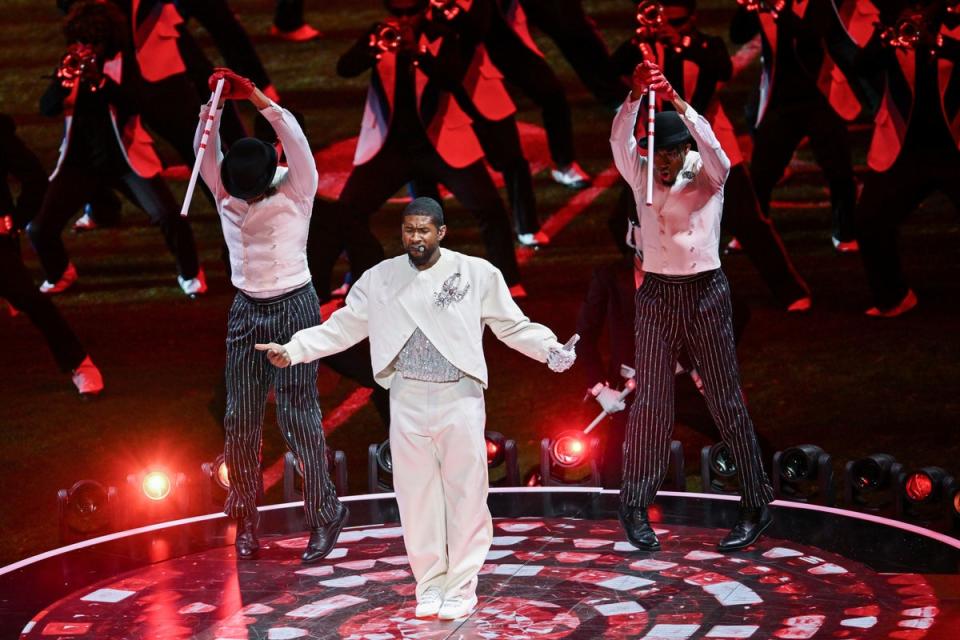 Usher in action during the halftime show (PA)