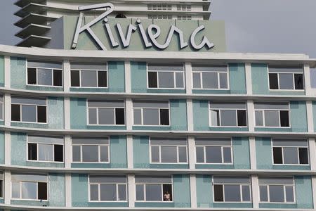 A man stands at the window of the Riviera Hotel in Havana December 9, 2015. REUTERS/Stringer