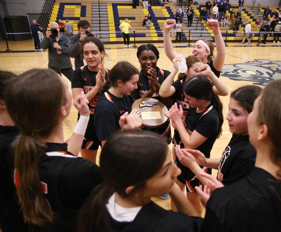 The Tuckahoe girls basketball team celebrate their victory in the New York State Class C regional final versus Millbrook on March 7, 2024.