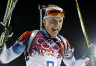 Czech Republic's Ondrej Moravec sticks his tongue out as he celebrates his silver medal in the men's biathlon 12.5k pursuit, at the 2014 Winter Olympics, Monday, Feb. 10, 2014, in Krasnaya Polyana, Russia. (AP Photo/Kirsty Wigglesworth)