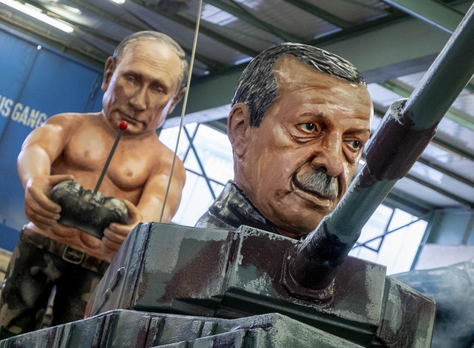 Two figures depicting Russia's President Vladimir Putin, left, and Turkish President Recep Tayyip Erdogan are shown during a press preview for the Mainz carnival, in Mainz, Germany, Tuesday, Feb. 18, 2020. (AP Photo/Michael Probst)