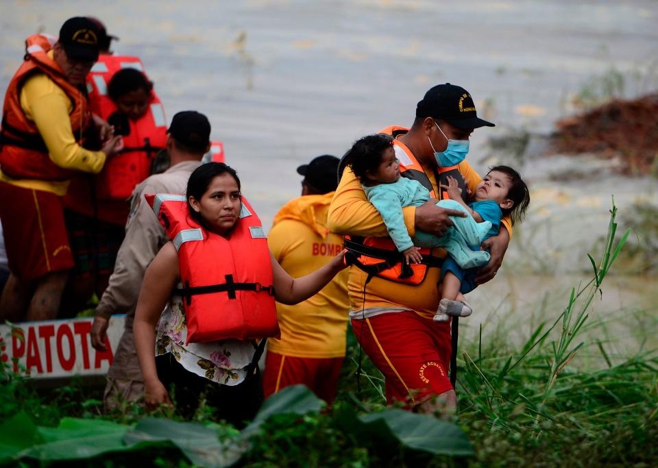 <p>Families are rescued amid flooding and landslides after Hurricane Eta struck in Honduras last month</p>AFP/Getty
