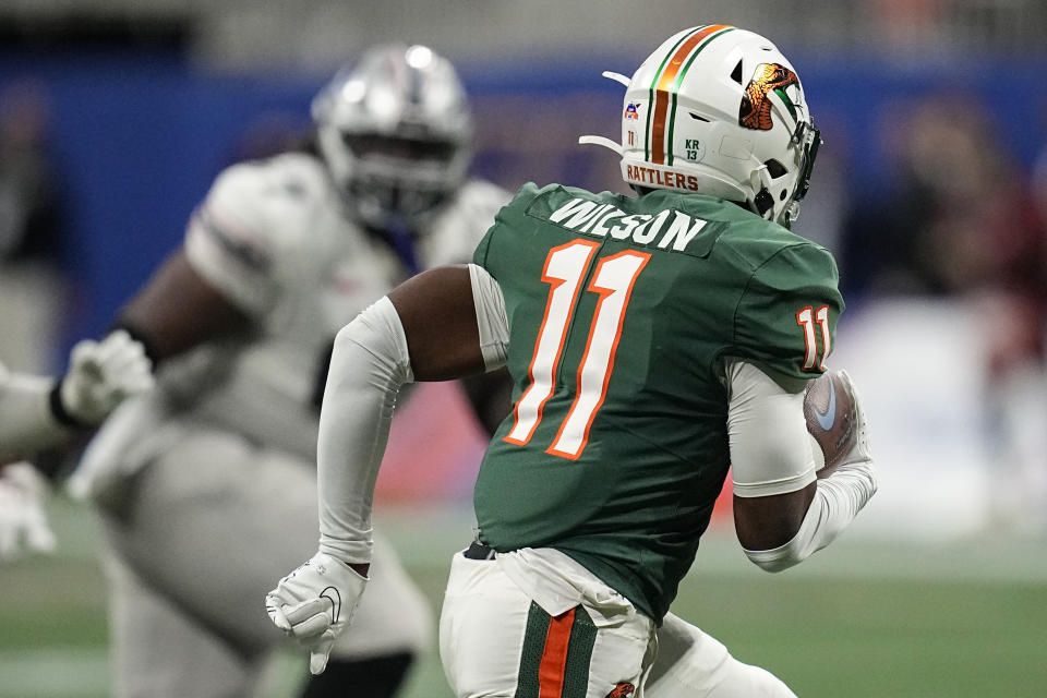 Florida A&M defensive back Deco Wilson (11) rubs after his interception against Howard during the first half of an NCAA Celebration Bowl football game, Saturday, Dec. 16, 2023, in Atlanta. (AP Photo/Mike Stewart)