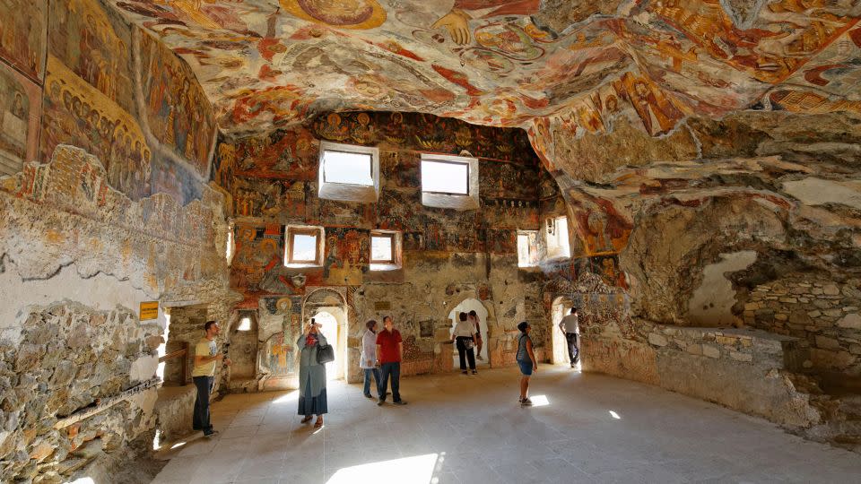 Frescoes cover the interior of the Rock Church at Sumela Monastery in Turkey's Black Sea region. - imageBROKER.com/Alamy Stock Photo