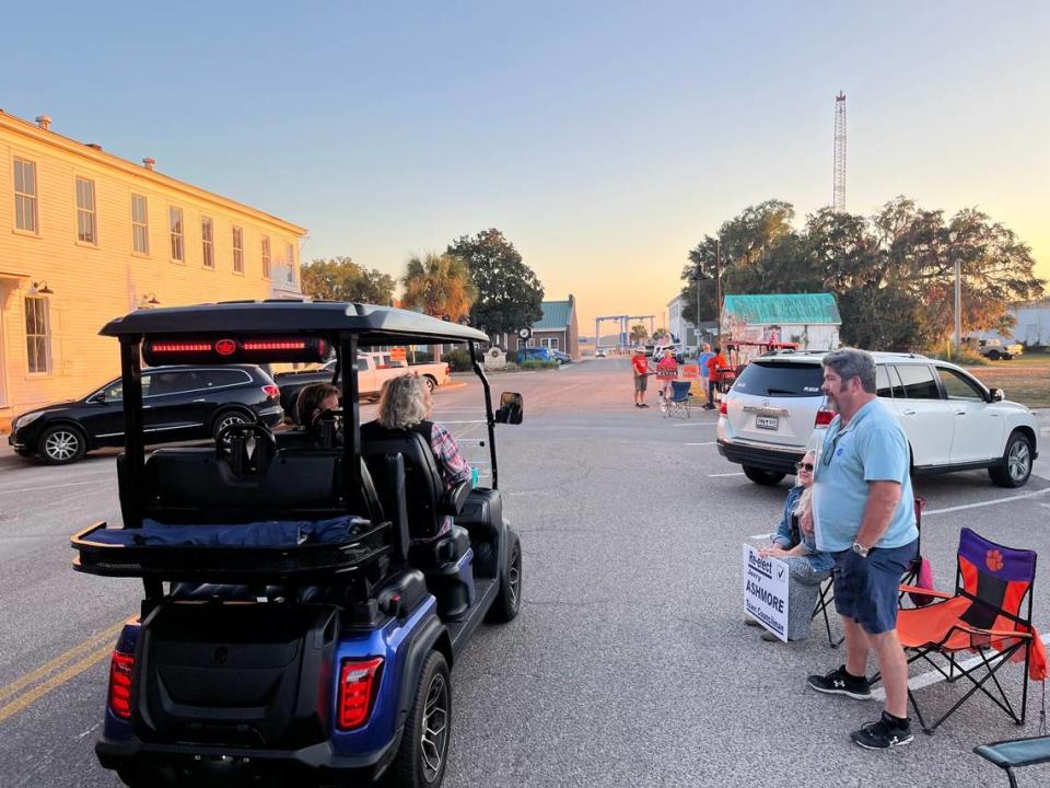 Jerry Ashmore, a candidate for Port Royal Town Council, chats with occupants of a passing golf cart as he campaigns prior to Tuesday’s election. Ashmore was unopposed in his race.