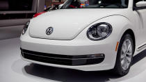 Volkswagen just unveiled the 2013 Volkswagen Beetle TDI, an oil-burning version of the recently revised and manliness-infused Beetle. America's only diesel two-door (VW considers this a coupe and the Golf a hatch) will go on sale this summer. The engine is VW's familiar 2.0 liter turbocharged and direct-injected 4-cylinder, now sporting a common-rail fuel injection setup and putting 140 horsepower and 238 lb/ft of torque into your choice of six-speed transmissions: either a traditional manual or the DSG semiautomatic. EPA fuel economy scores of 29 mpg city and 39 mpg highway have been confirmed.