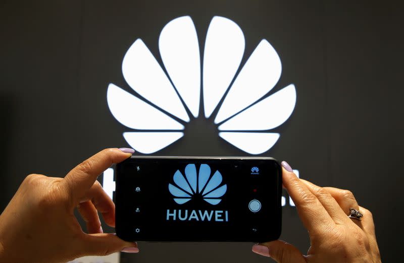 FILE PHOTO: A Huawei logo is seen on a cell phone screen in their store at Vina del Mar